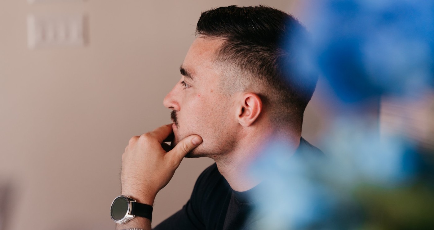 Devon at his desk, thinking through a client plan